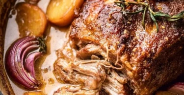 Delicious apple cider braised pork shoulder served on a plate