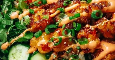 Delicious Bang Bang Chicken Bowl Delight with vibrant vegetables and spicy sauce.