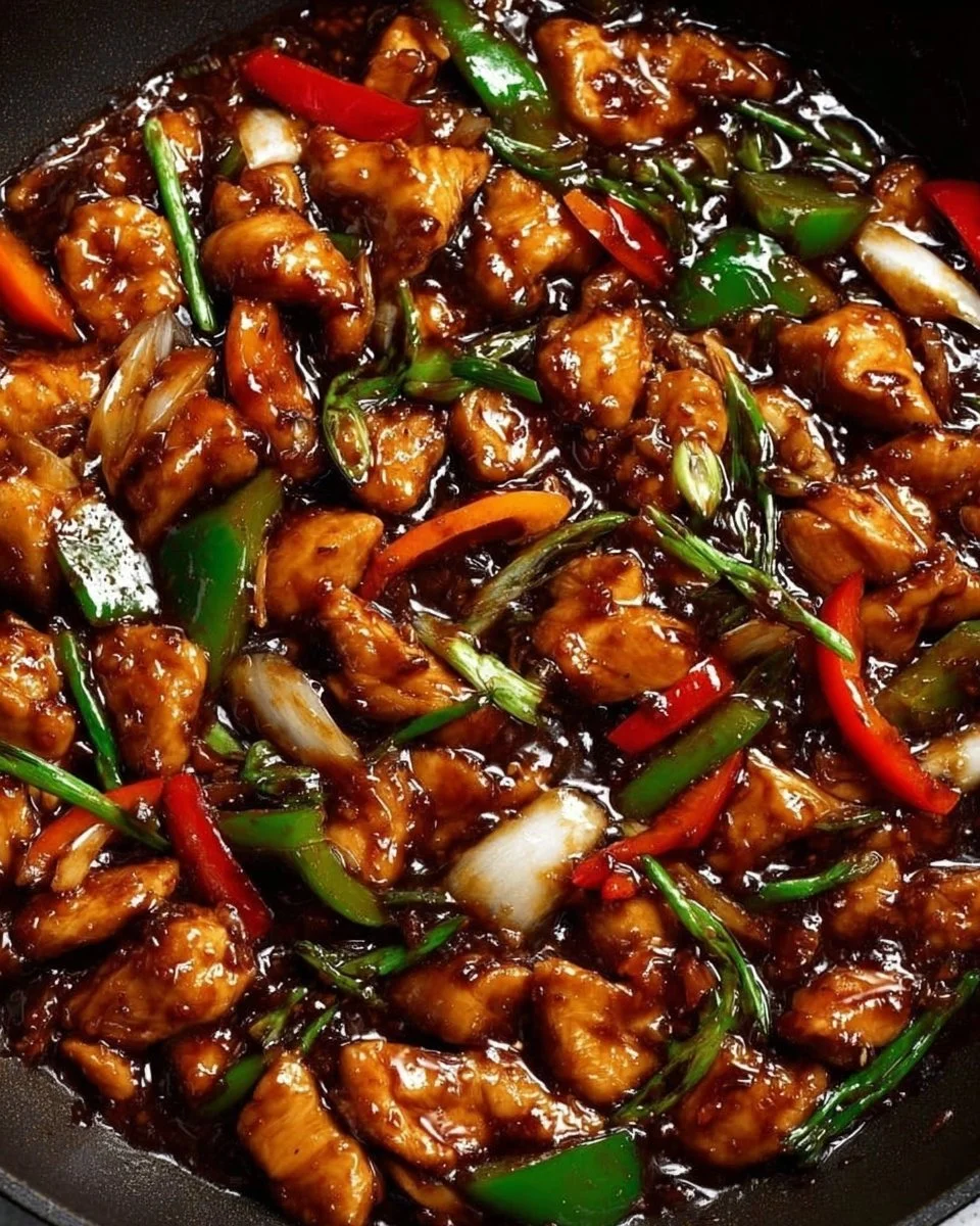Delicious chicken in garlic sauce served on a plate with herbs.