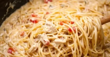 Crock Pot Cheesy Chicken Spaghetti dish prepared with creamy sauce and chicken