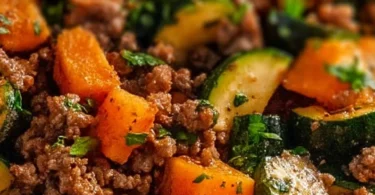 Ground beef zucchini sweet potato skillet with colorful vegetables in a pan