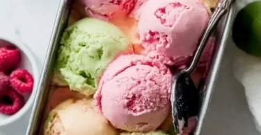 Bowl of colorful homemade rainbow sherbet with vibrant fruit flavors