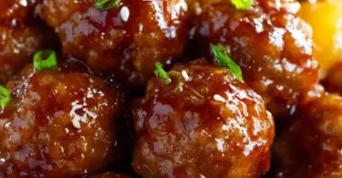 Slow cooker teriyaki meatballs served with rice and vegetables