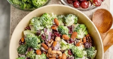 Bowl of colorful Vegan Broccoli Salad with fresh vegetables and dressing